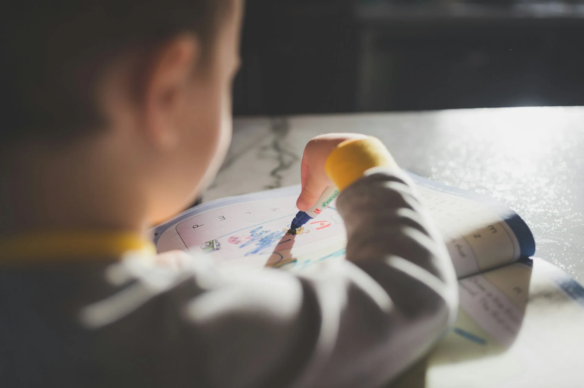 Young boy colouring