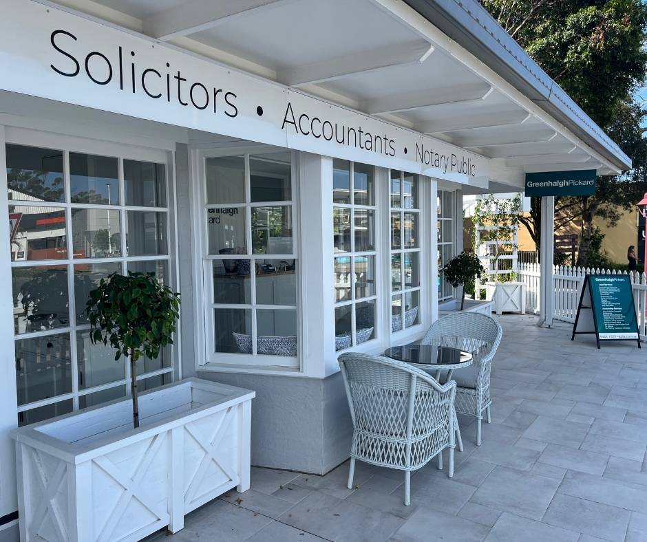 Outside buderim office with sign that says solicitors accountants