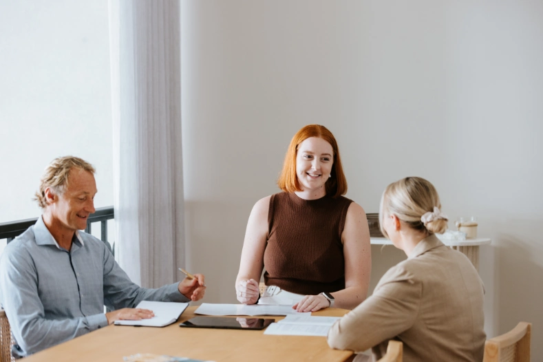 smiling red haired professional at wills and estate meeting